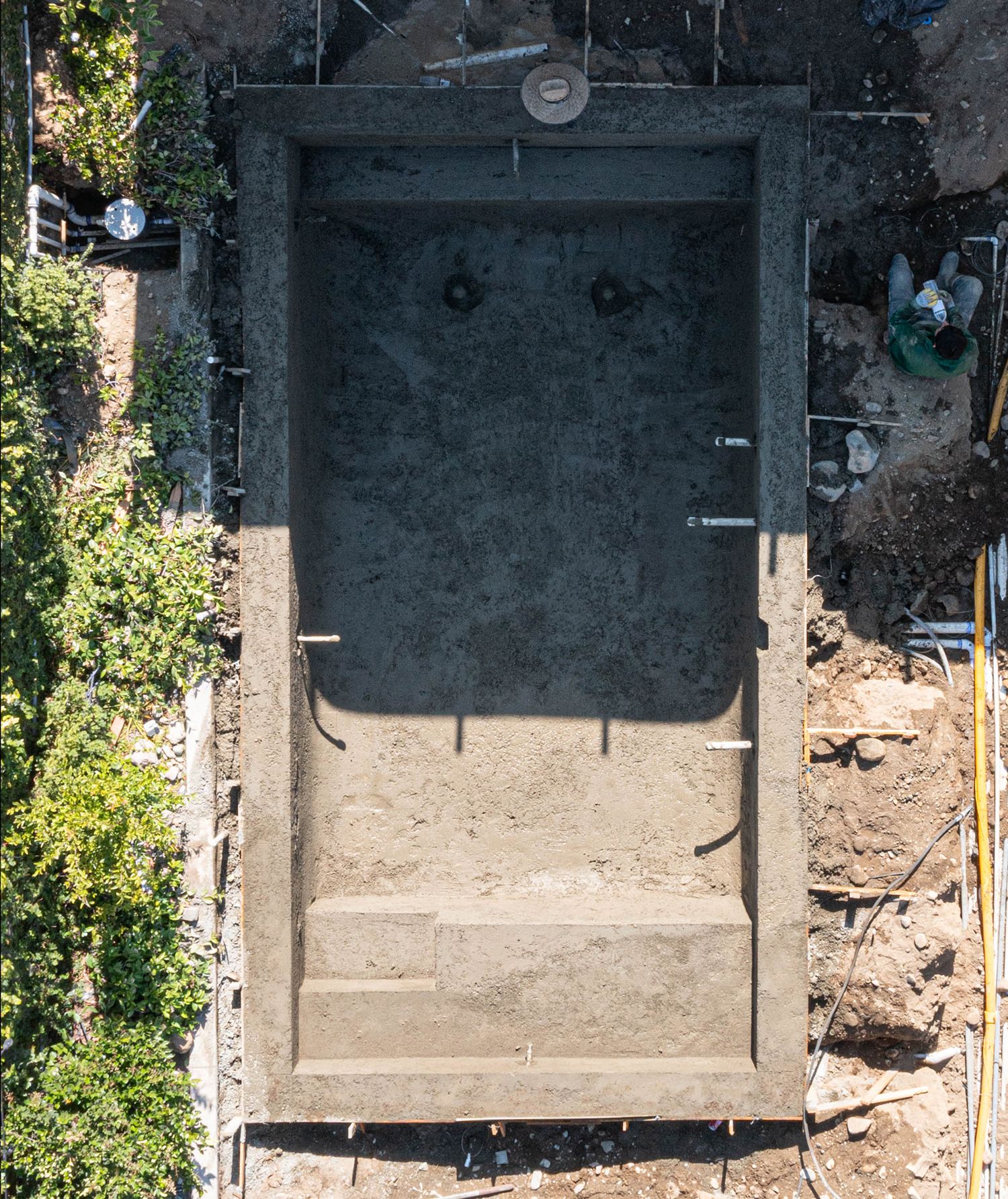 Aerial view of completed shotcrete pool shell with steps and smooth concrete walls