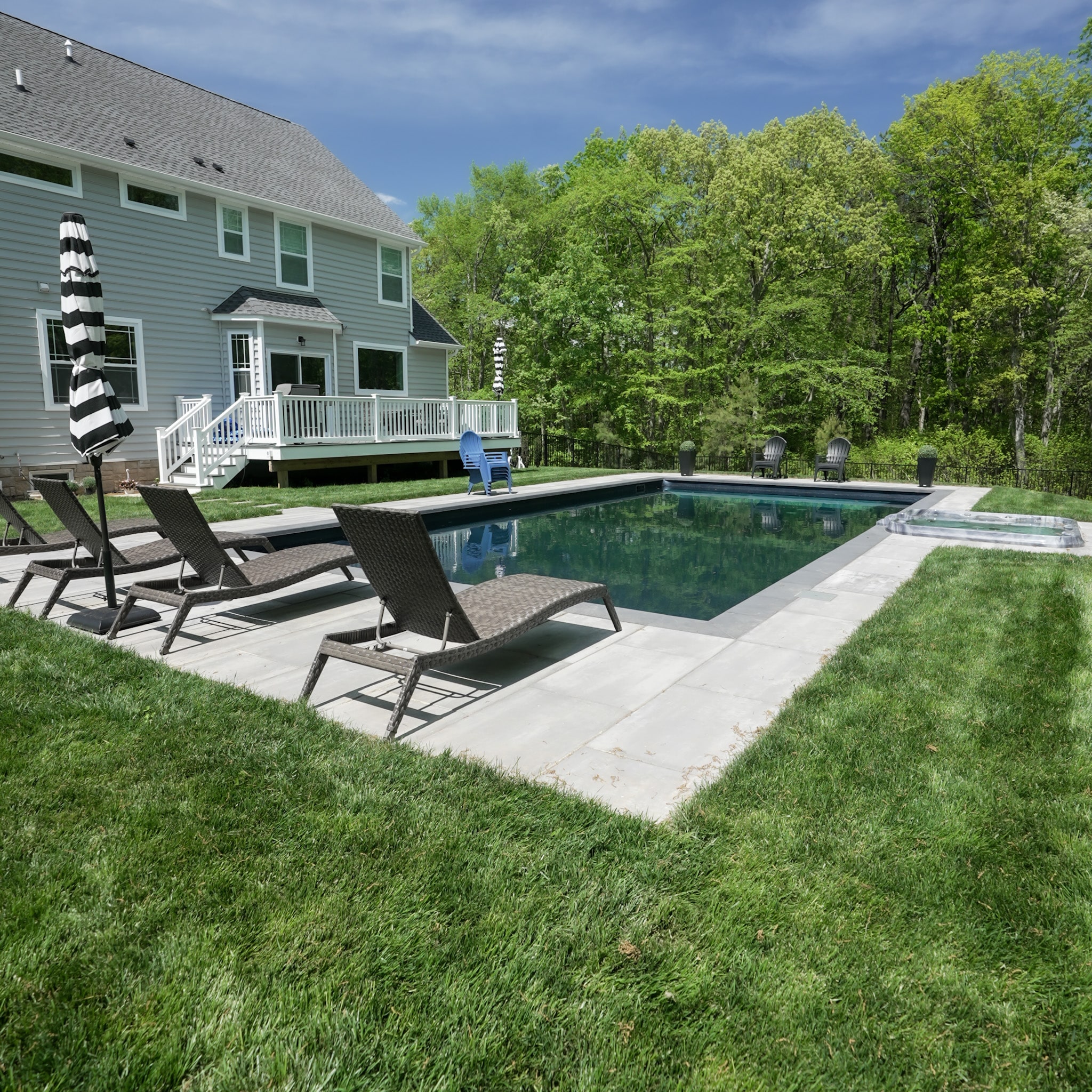Modern Pool with Stone Paver Patio