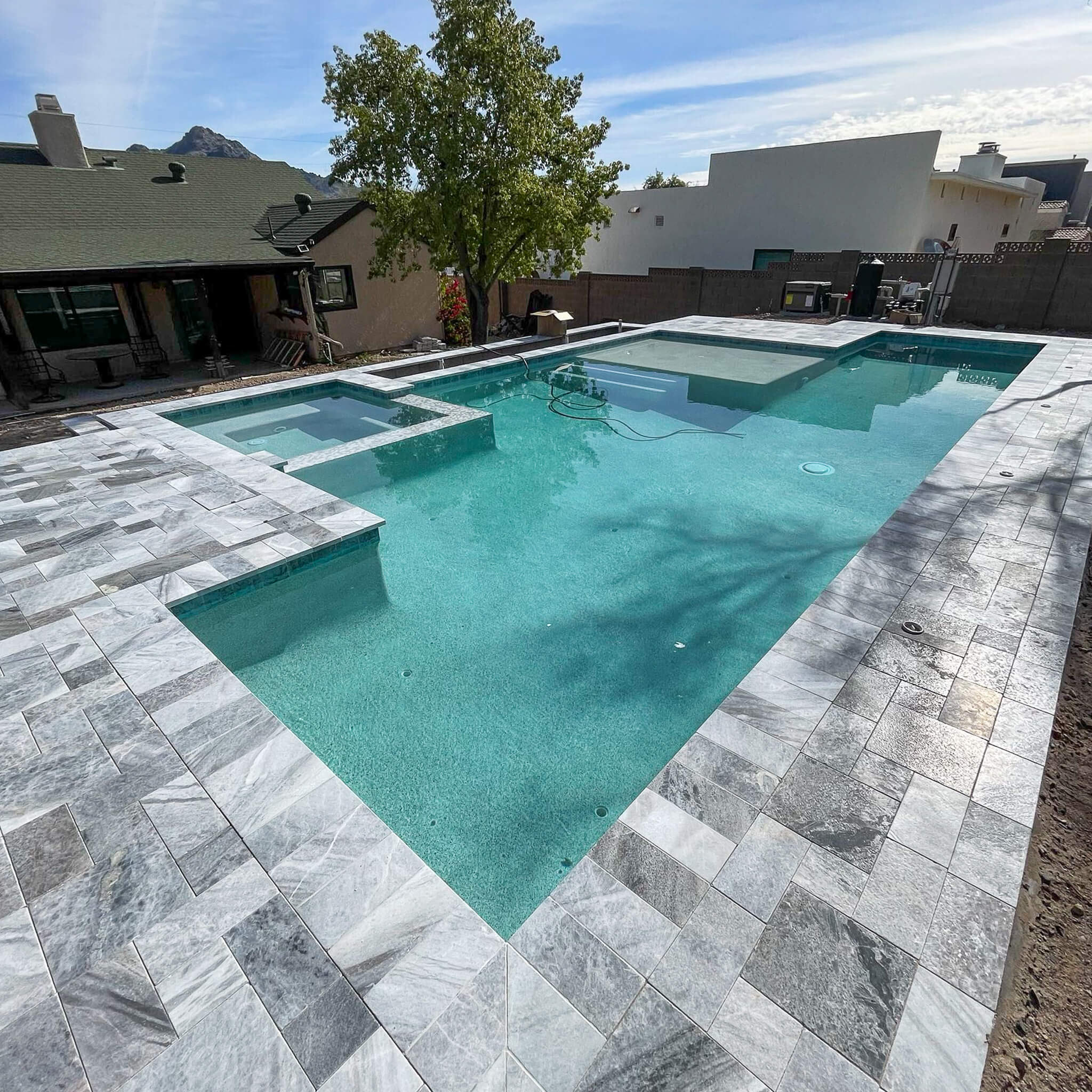 Geometric Pool with Travertine Pavers